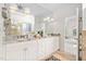 Bathroom features double vanity with granite counters, tile floors and a large mirror at 112 Trellingwood Dr, Morrisville, NC 27560