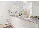 Bathroom features double vanity with granite counters, tile floors and a large mirror at 112 Trellingwood Dr, Morrisville, NC 27560