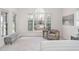 Bright bedroom features a sitting area with large windows and neutral decor at 112 Trellingwood Dr, Morrisville, NC 27560
