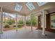 Spacious outdoor patio featuring skylights and views of the lush garden, perfect for relaxation and entertaining at 112 Trellingwood Dr, Morrisville, NC 27560