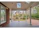 Open-air patio with stately columns, skylights and views of the backyard gardens, creating a tranquil retreat at 112 Trellingwood Dr, Morrisville, NC 27560