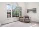 Sun-drenched sunroom featuring large windows and a comfortable seating area at 112 Trellingwood Dr, Morrisville, NC 27560