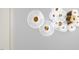 Close up of modern decorative wall art with white and gold accents at 112 Trellingwood Dr, Morrisville, NC 27560