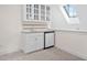 Wet bar with cabinets and a mini fridge is perfect for entertaining at 112 Trellingwood Dr, Morrisville, NC 27560