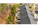 Aerial view of the townhomes featuring private back patios and mature trees at 116 Anterbury Dr, Apex, NC 27502