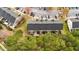 Aerial view of condo community featuring trees, parking and landscaping at 116 Anterbury Dr, Apex, NC 27502