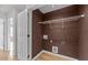 This is a laundry room with white wire shelving and laminate flooring at 116 Anterbury Dr, Apex, NC 27502