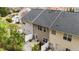Back exterior view showcasing a private patio and well-maintained yard at 116 Anterbury Dr, Apex, NC 27502