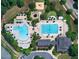 Aerial view of community pool and amenities, highlighting recreational facilities and lush landscaping at 1301 Durlain Dr # 108, Raleigh, NC 27614