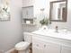 Charming bathroom featuring gray walls, a vanity with drawers, and decorative accents at 1301 Durlain Dr # 108, Raleigh, NC 27614