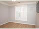 Bright bedroom with large window and plantation shutters at 1301 Durlain Dr # 108, Raleigh, NC 27614