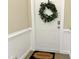 Welcoming entrance with a 'welcome' mat and a decorative wreath on the door for a personal touch at 1301 Durlain Dr # 108, Raleigh, NC 27614