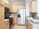 Well-equipped kitchen with stainless steel appliances, granite countertops, and ample cabinet space at 1301 Durlain Dr # 108, Raleigh, NC 27614