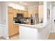 Modern kitchen with granite countertops, stainless steel appliances, and eat-in bar at 1301 Durlain Dr # 108, Raleigh, NC 27614