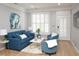 Bright living room with comfortable seating, chic decor, and large windows at 1301 Durlain Dr # 108, Raleigh, NC 27614