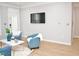 Bright living room featuring comfortable seating, stylish decor and bright paint at 1301 Durlain Dr # 108, Raleigh, NC 27614