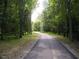 Scenic walking path surrounded by lush greenery offers residents a tranquil escape into nature at 1301 Durlain Dr # 108, Raleigh, NC 27614