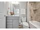 Cozy bathroom featuring a vanity, shower-tub combo, and neutral decor at 138 Tressel Way, Durham, NC 27707