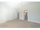 Large bedroom with a ceiling fan and view of an ensuite bathroom with a vanity at 138 Tressel Way, Durham, NC 27707