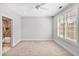 Bright, spacious bedroom with neutral carpet, plantation shutters, and an ensuite bathroom at 138 Tressel Way, Durham, NC 27707