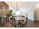 Charming dining space featuring wood floors, a round table, a built-in cabinet, and natural light at 138 Tressel Way, Durham, NC 27707