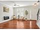 Open living room with hardwood floors, modern furnishings, and a staircase leading to the upper level at 138 Tressel Way, Durham, NC 27707