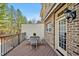 Inviting outdoor deck with seating, a black iron railing, and views of the surrounding landscape at 138 Tressel Way, Durham, NC 27707