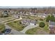 Wide aerial shot of the home featuring a spacious driveway and well-manicured front yard at 1408 Harvey Johnson Rd, Raleigh, NC 27603