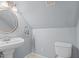 Charming bathroom featuring a pedestal sink, and a classic toilet at 1408 Harvey Johnson Rd, Raleigh, NC 27603