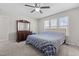 Bedroom with a ceiling fan, carpeted floors, and large dresser at 1408 Harvey Johnson Rd, Raleigh, NC 27603