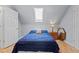 Bedroom featuring a skylight, bedside tables and lamps, and a comfortable bed at 1408 Harvey Johnson Rd, Raleigh, NC 27603
