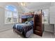 bedroom with a wooden bunkbed, plush carpet, a ceiling fan, and a large window at 1408 Harvey Johnson Rd, Raleigh, NC 27603