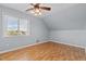 Light-filled bedroom featuring a ceiling fan and hardwood floors at 1408 Harvey Johnson Rd, Raleigh, NC 27603