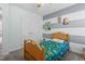 bedroom featuring a striped accent wall, plush carpet, and a window at 1408 Harvey Johnson Rd, Raleigh, NC 27603