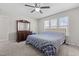 Spacious bedroom features a ceiling fan, a dresser, and natural lighting at 1408 Harvey Johnson Rd, Raleigh, NC 27603