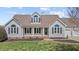 Charming home featuring a welcoming front porch, well-manicured lawn, and classic architectural details at 1408 Harvey Johnson Rd, Raleigh, NC 27603