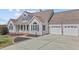 Home featuring neutral siding, complemented by dark shutters and a neatly landscaped yard at 1408 Harvey Johnson Rd, Raleigh, NC 27603