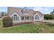 Charming home boasts great curb appeal with well-maintained lawn and inviting front porch at 1408 Harvey Johnson Rd, Raleigh, NC 27603
