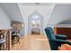 A well-lit bonus room with wood floors, vaulted ceilings, and bar seating at 1408 Harvey Johnson Rd, Raleigh, NC 27603