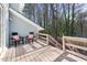 Back deck with outdoor seating and wooded views at 1515 Edgeside Ct, Raleigh, NC 27609