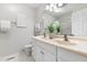 Bright bathroom featuring a double vanity, hexagon tile flooring, and neutral color palette at 1515 Edgeside Ct, Raleigh, NC 27609
