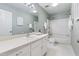 Bathroom with a single vanity, tub and shower combination, and hexagon tile flooring at 1515 Edgeside Ct, Raleigh, NC 27609