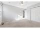 Spacious bedroom featuring neutral carpet, ceiling fan, and closet at 1515 Edgeside Ct, Raleigh, NC 27609