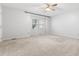 Spacious bedroom offers natural light and a ceiling fan, with neutral carpet at 1515 Edgeside Ct, Raleigh, NC 27609