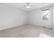 Bedroom with neutral walls, carpeted floor, and bright window at 1515 Edgeside Ct, Raleigh, NC 27609