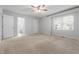 Light-filled bedroom featuring carpet, a ceiling fan, and ensuite access at 1515 Edgeside Ct, Raleigh, NC 27609