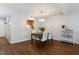 Charming dining area with wood floors, table and chairs, and a serving cart at 1515 Edgeside Ct, Raleigh, NC 27609