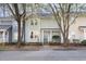 Charming townhome featuring a landscaped front yard and a welcoming covered front porch at 1515 Edgeside Ct, Raleigh, NC 27609