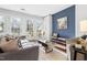Sun-filled living room with hardwood floors, French doors and stylish furniture at 1515 Edgeside Ct, Raleigh, NC 27609