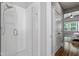 Bright bathroom featuring glass shower door and neutral white tile at 1564 Highpoint St, Wake Forest, NC 27587